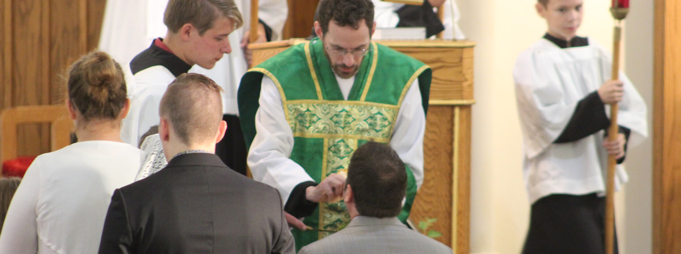 Father passing out holy communion